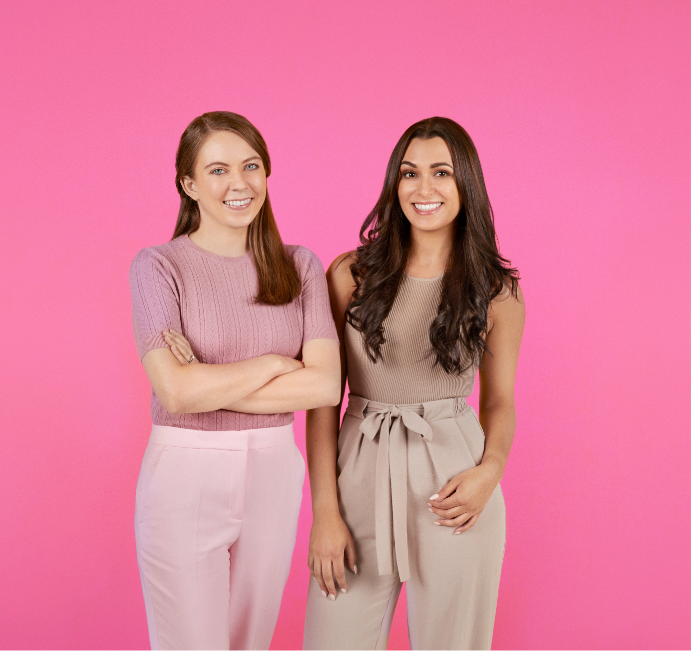 The two competition hosts on pink