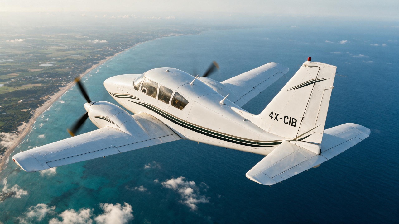 goATC’s Piper Aztec 4X-CIB in flight over the coastline